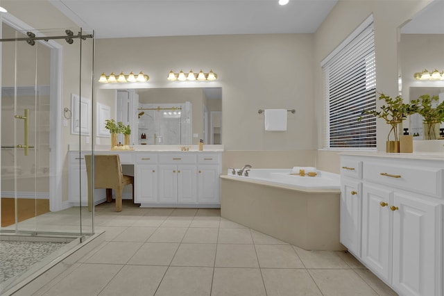 bathroom with tile patterned flooring, vanity, and shower with separate bathtub