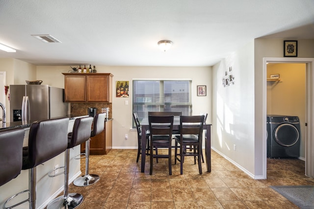 dining room with washer / clothes dryer