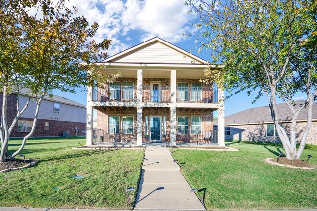 view of front of property featuring a balcony and a front lawn