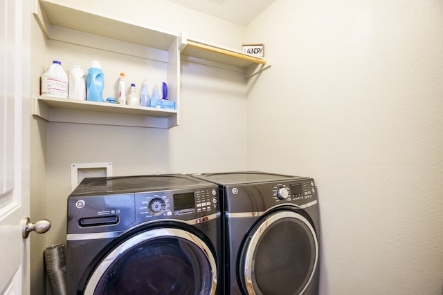 laundry room featuring washing machine and clothes dryer