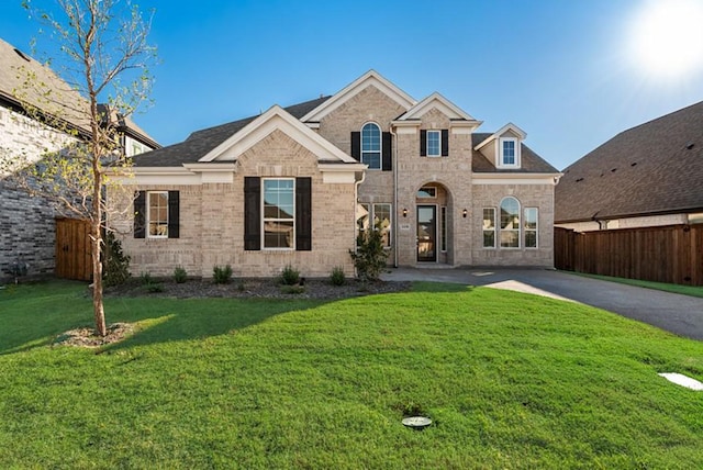 view of front of home with a front lawn