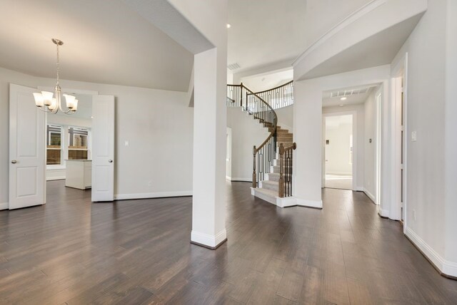 2438 Meridian Pl, Midlothian, TX 76065 - unfurnished living room with a chandelier, dark wood-type flooring, stairway, and baseboards