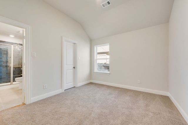 2438 Meridian Pl, Midlothian, TX 76065 - unfurnished bedroom featuring light carpet, lofted ceiling, baseboards, and connected bathroom