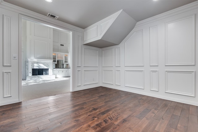 interior space with dark hardwood / wood-style floors and a fireplace