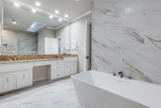 bathroom featuring vanity, a bathtub, and crown molding