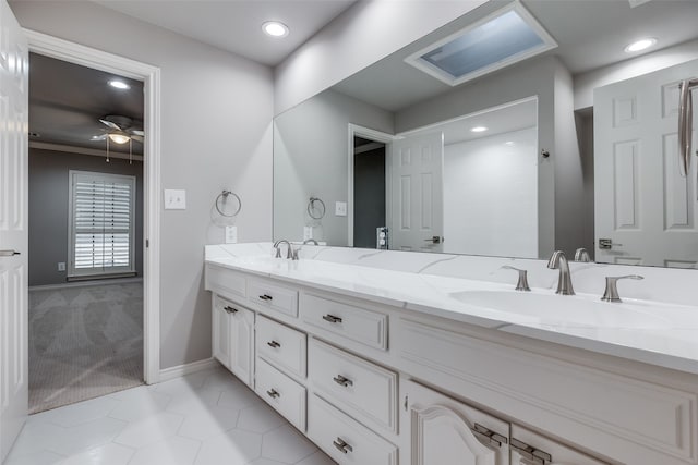 bathroom featuring vanity, tile patterned floors, and ceiling fan