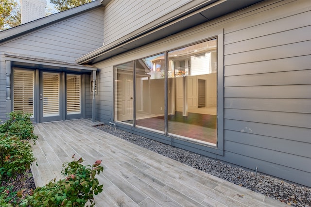 wooden deck with a patio