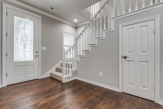 foyer featuring dark wood-type flooring and a healthy amount of sunlight