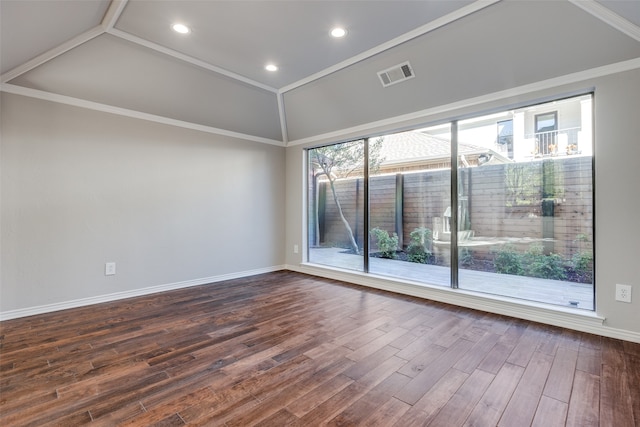 unfurnished room featuring dark hardwood / wood-style flooring, lofted ceiling, and ornamental molding