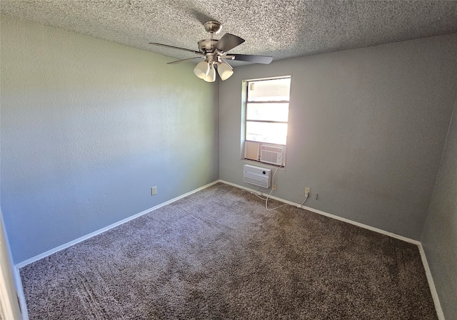 spare room featuring carpet flooring, ceiling fan, an AC wall unit, and a textured ceiling