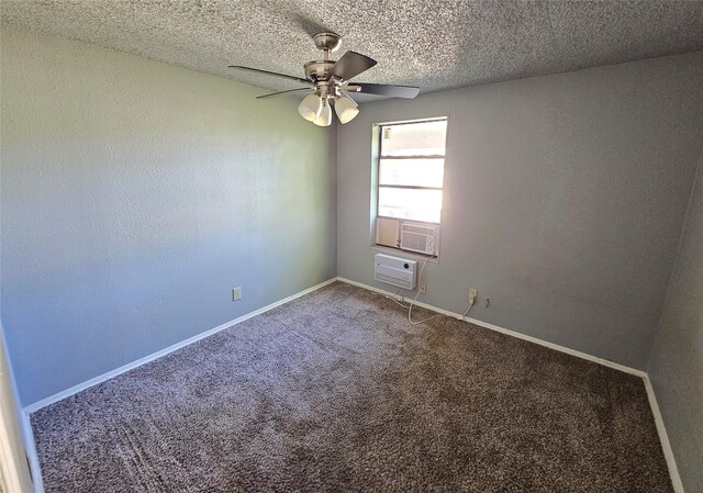 spare room featuring carpet flooring, ceiling fan, an AC wall unit, and a textured ceiling