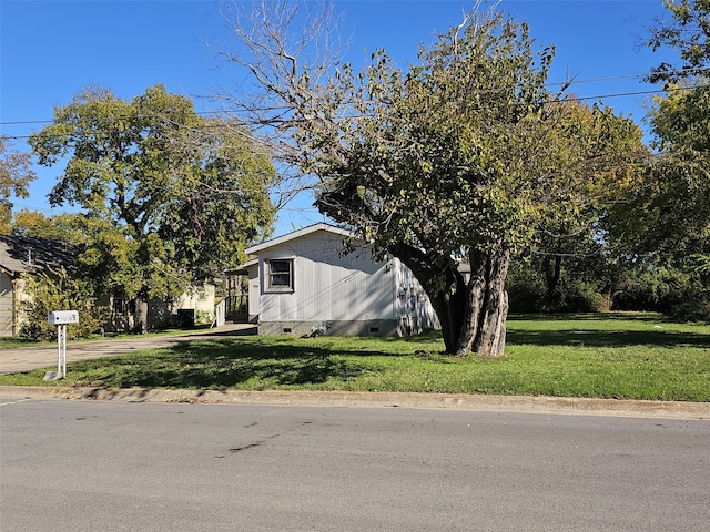 view of home's exterior featuring a yard