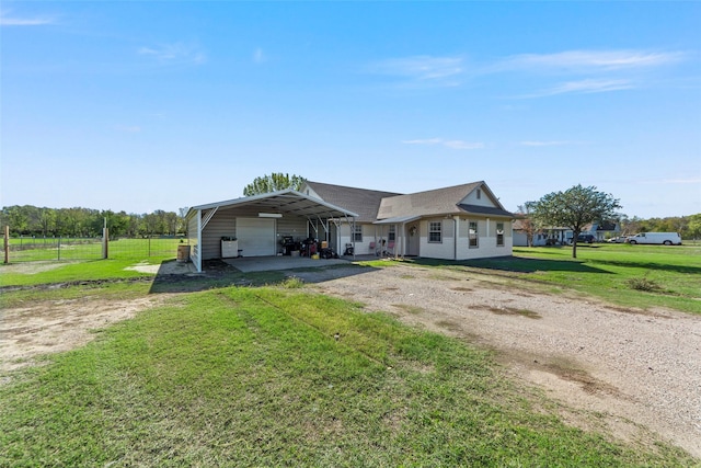 ranch-style house with a garage, a front yard, and a carport