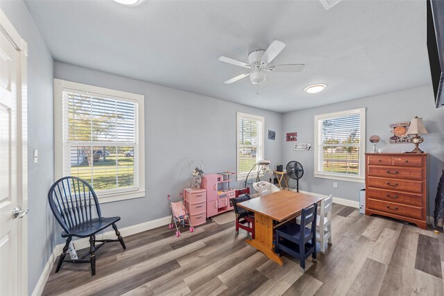 interior space with hardwood / wood-style flooring and ceiling fan