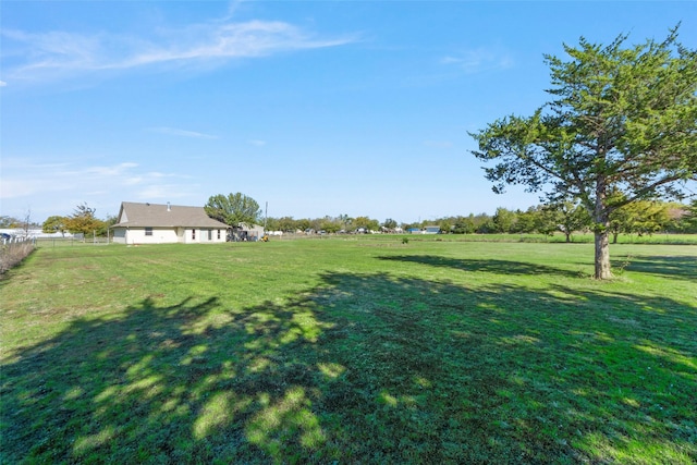 view of yard with a rural view