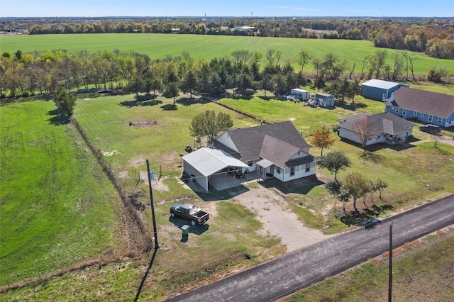 birds eye view of property with a rural view