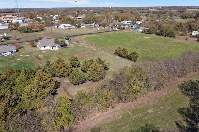 birds eye view of property with a rural view