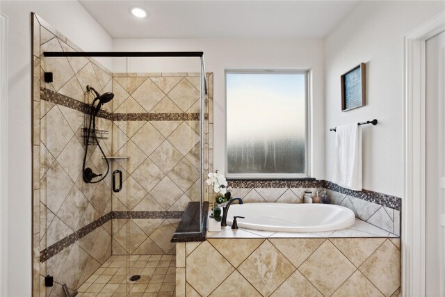 bathroom featuring plus walk in shower