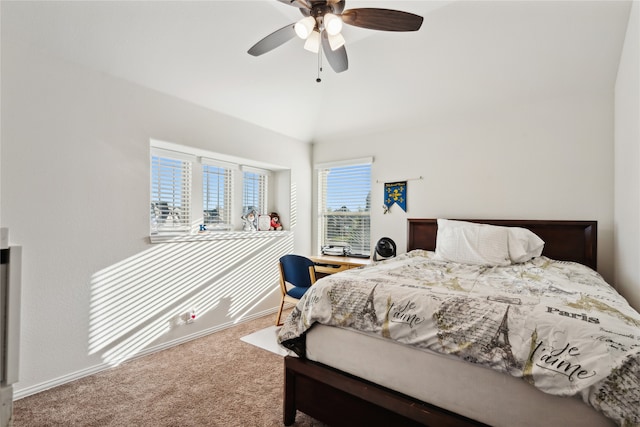 carpeted bedroom featuring ceiling fan, lofted ceiling, and multiple windows