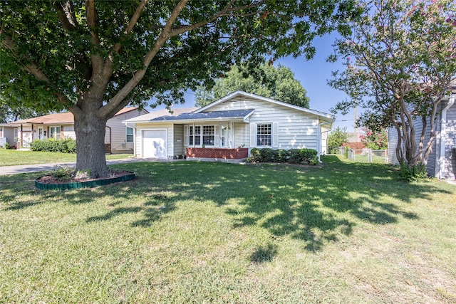 single story home with a front lawn and a garage