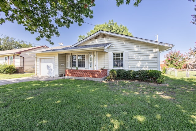 ranch-style house featuring a front lawn and a garage