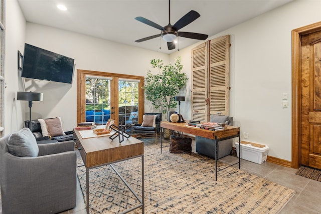 office space with french doors, light tile patterned floors, and ceiling fan