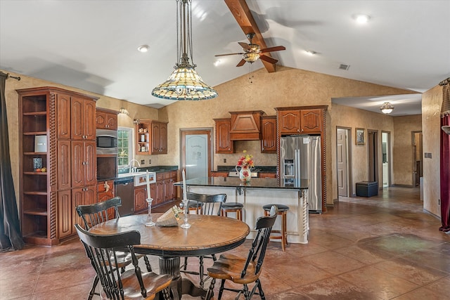 dining space featuring vaulted ceiling with beams, ceiling fan, and sink