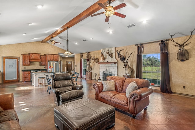 living room featuring tile patterned floors, ceiling fan, a fireplace, and lofted ceiling with beams