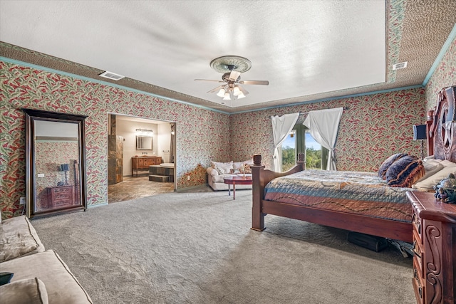 carpeted bedroom with a textured ceiling, ceiling fan, and ornamental molding