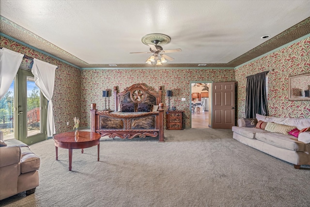 carpeted living room with ceiling fan and a textured ceiling