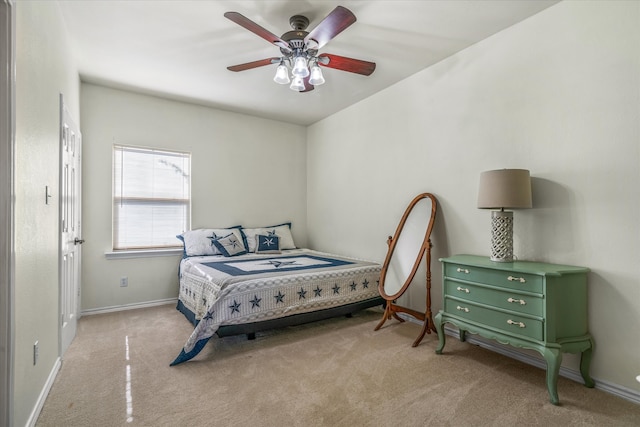 bedroom featuring ceiling fan and light carpet