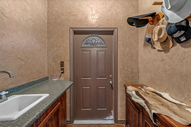 doorway to property with sink