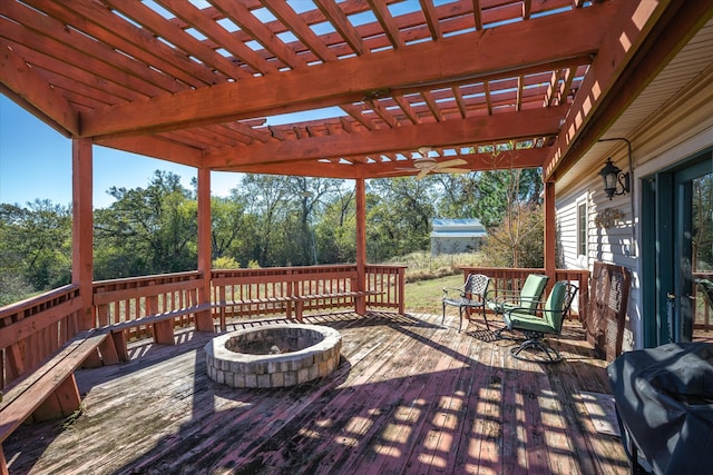 deck with a pergola, area for grilling, and an outdoor fire pit