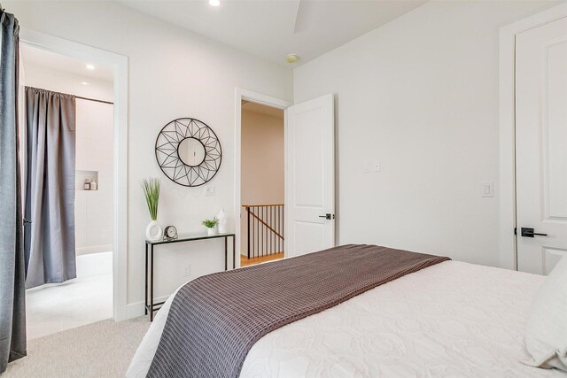 bedroom featuring light carpet