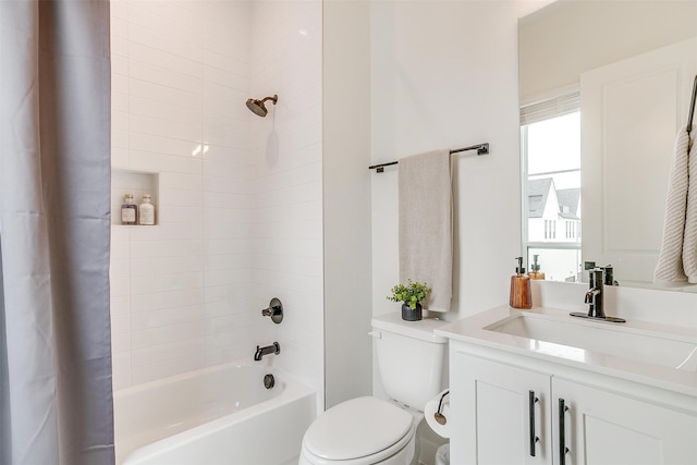 full bathroom with vanity, toilet, and shower / bath combo with shower curtain