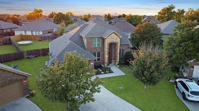 view of front of home with a lawn