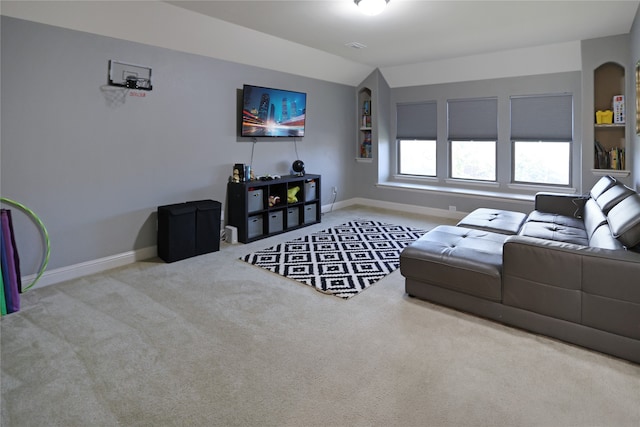 living room featuring carpet floors and lofted ceiling