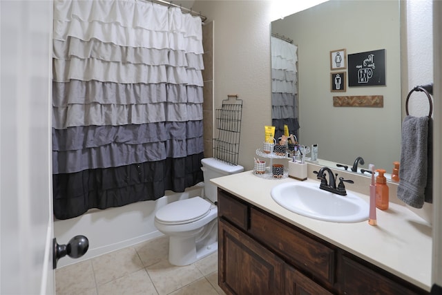 full bathroom with tile patterned floors, vanity, toilet, and shower / bath combo with shower curtain