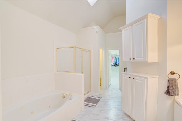 bathroom featuring independent shower and bath and vaulted ceiling