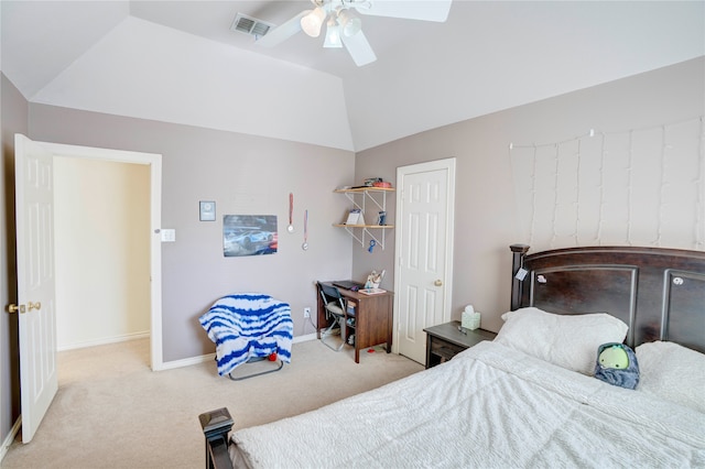 carpeted bedroom with ceiling fan and vaulted ceiling