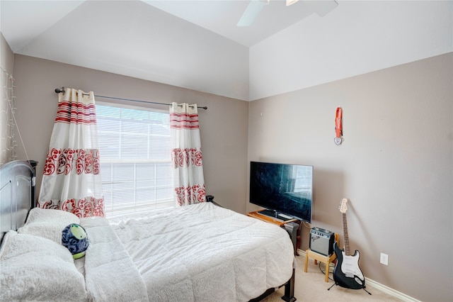 bedroom featuring carpet, ceiling fan, and vaulted ceiling