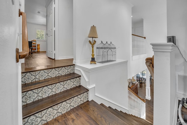 stairway featuring hardwood / wood-style floors