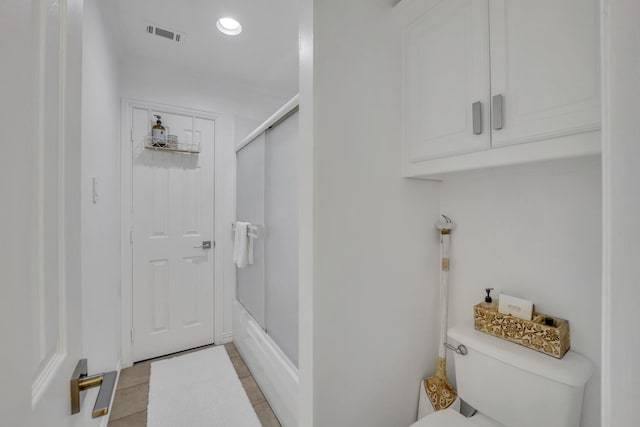 2405 Deer Run Ct, Heath, TX 75032 - bathroom with tile patterned flooring, enclosed tub / shower combo, and recessed lighting