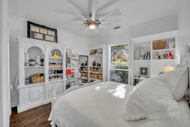 bedroom featuring crown molding, ceiling fan, and dark wood-type flooring