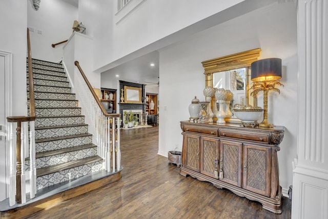 2405 Deer Run Ct, Heath, TX 75032 - stairway with wood finished floors, decorative columns, and recessed lighting