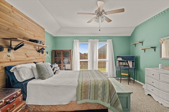 carpeted bedroom featuring ceiling fan and vaulted ceiling