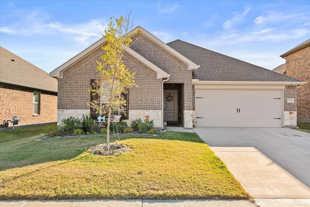 view of front facade with a front lawn and a garage