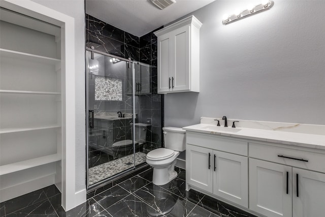 bathroom featuring vanity, toilet, and walk in shower