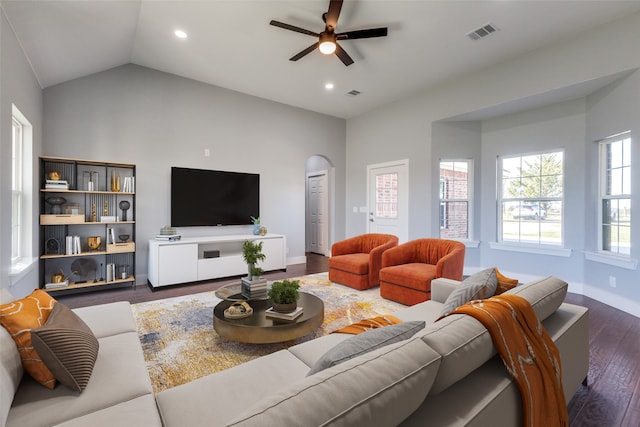 living room featuring dark hardwood / wood-style floors, ceiling fan, and lofted ceiling