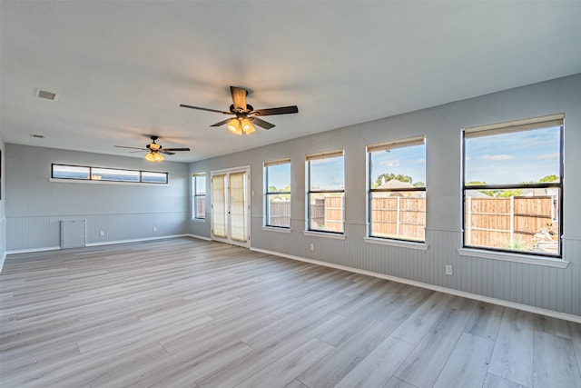 spare room with ceiling fan and light hardwood / wood-style flooring